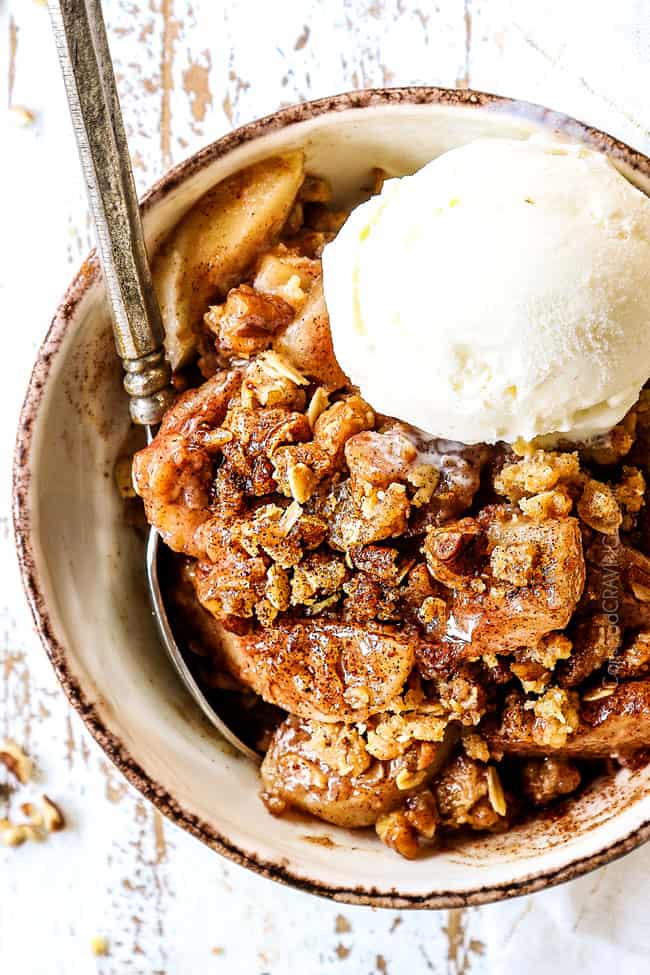top view of pear crisp recipe with a scoop of vanilla ice cream