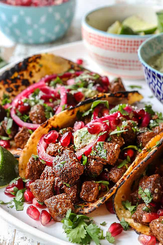 up close of steak tacos showing the juicy seasoned steak