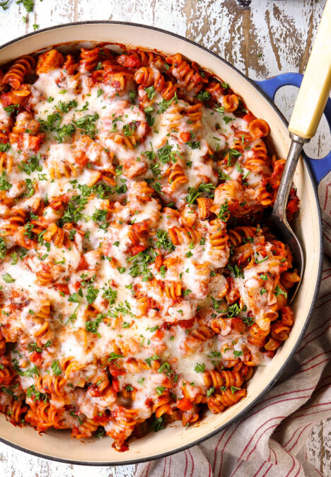top view of Parmesan Chicken Pasta in a skillet with mozzarella cheese
