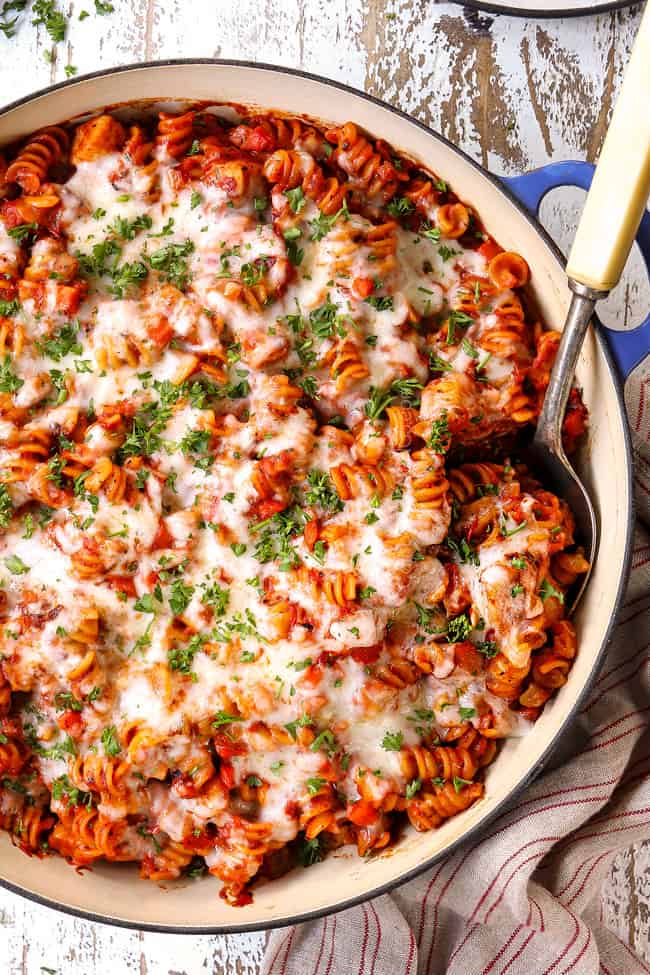 top view of Parmesan Chicken Pasta in a skillet with mozzarella cheese