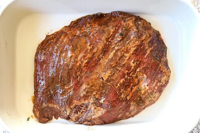 showing how to make London Broil recipe by placing steak in a 9x13 baking dish