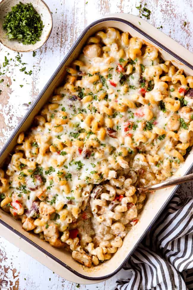 top view of Cajun Chicken Pasta Alfredo with a spoon taking a scoop
