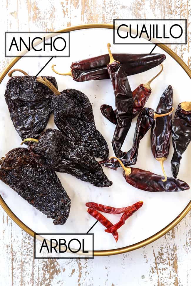 showing how to make birria recipe by showing what ancho, guajillo and arbol chilies look