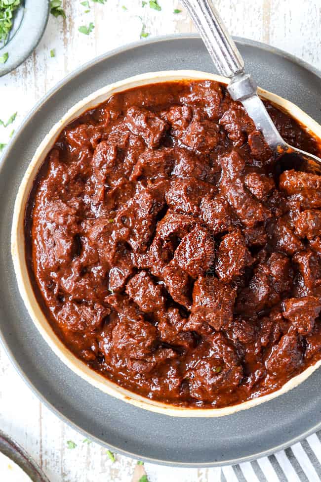 top view of Chile Colorado recipe in a bowl with a spoon