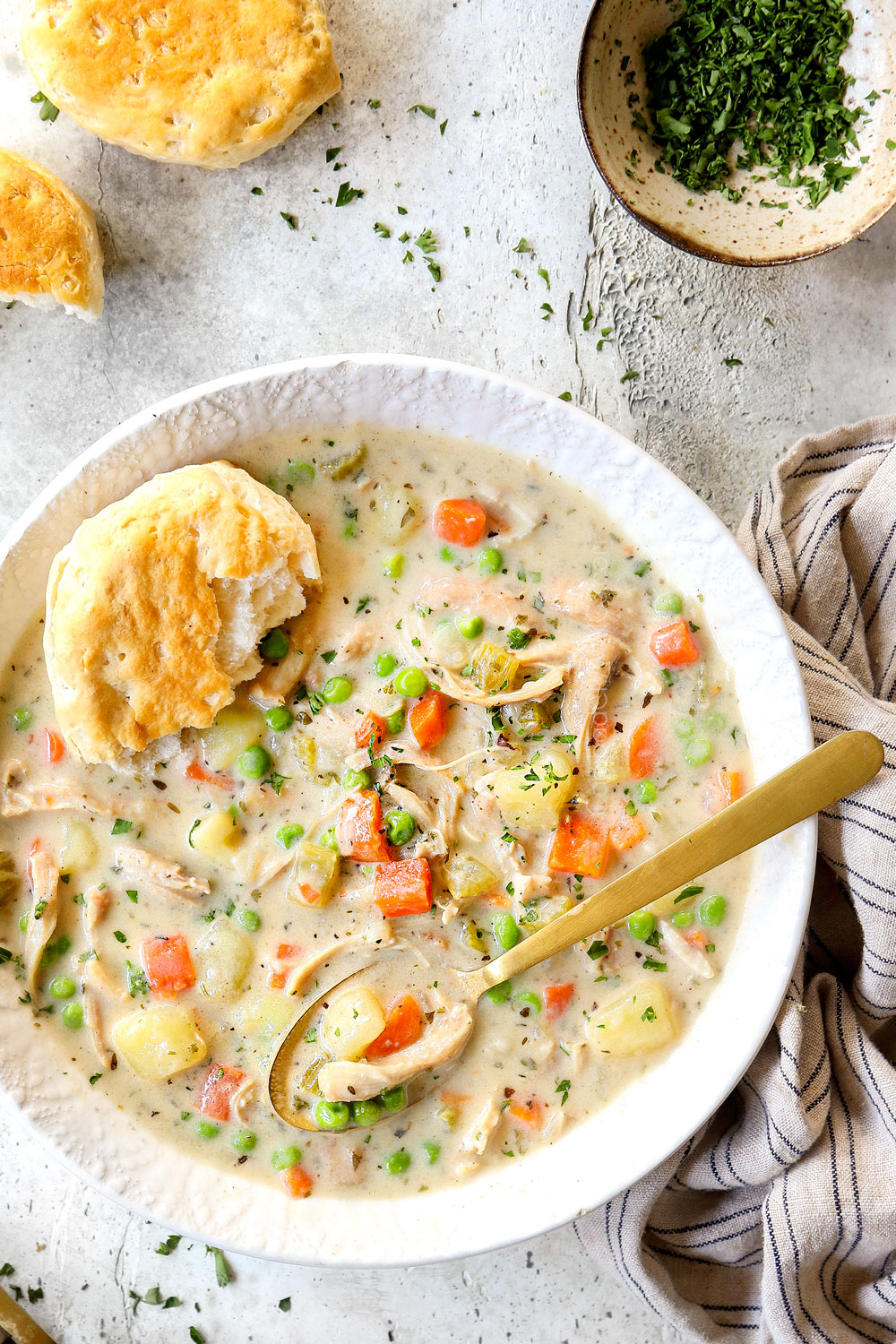 top view of a bowl of chicken pot pie soup garnished with parsley