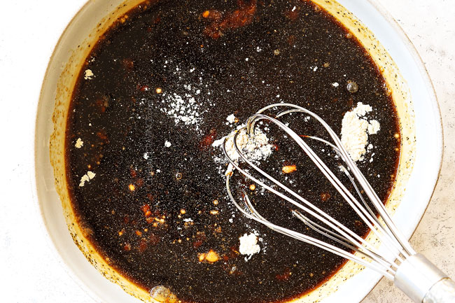 showing how to make beef teriyaki recipe by whisking together teriyaki sauce ingredients in a bowl