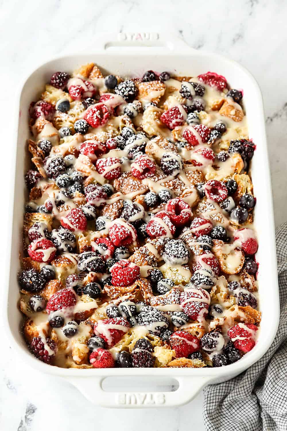 overnight breakfast casserole with croissants in a 9x13 casserole dish