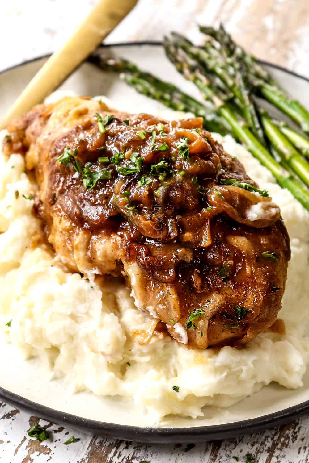 up close of a piece of French onion chicken showing how cheesy it is