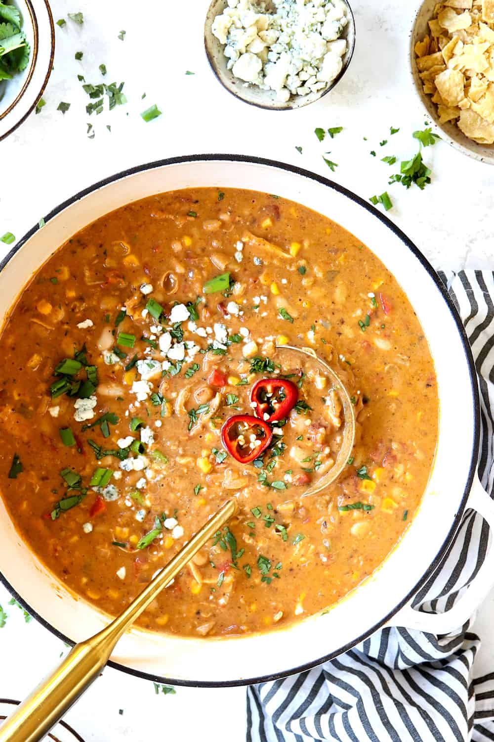 top view of a pot of buffalo chicken chili with a ladle