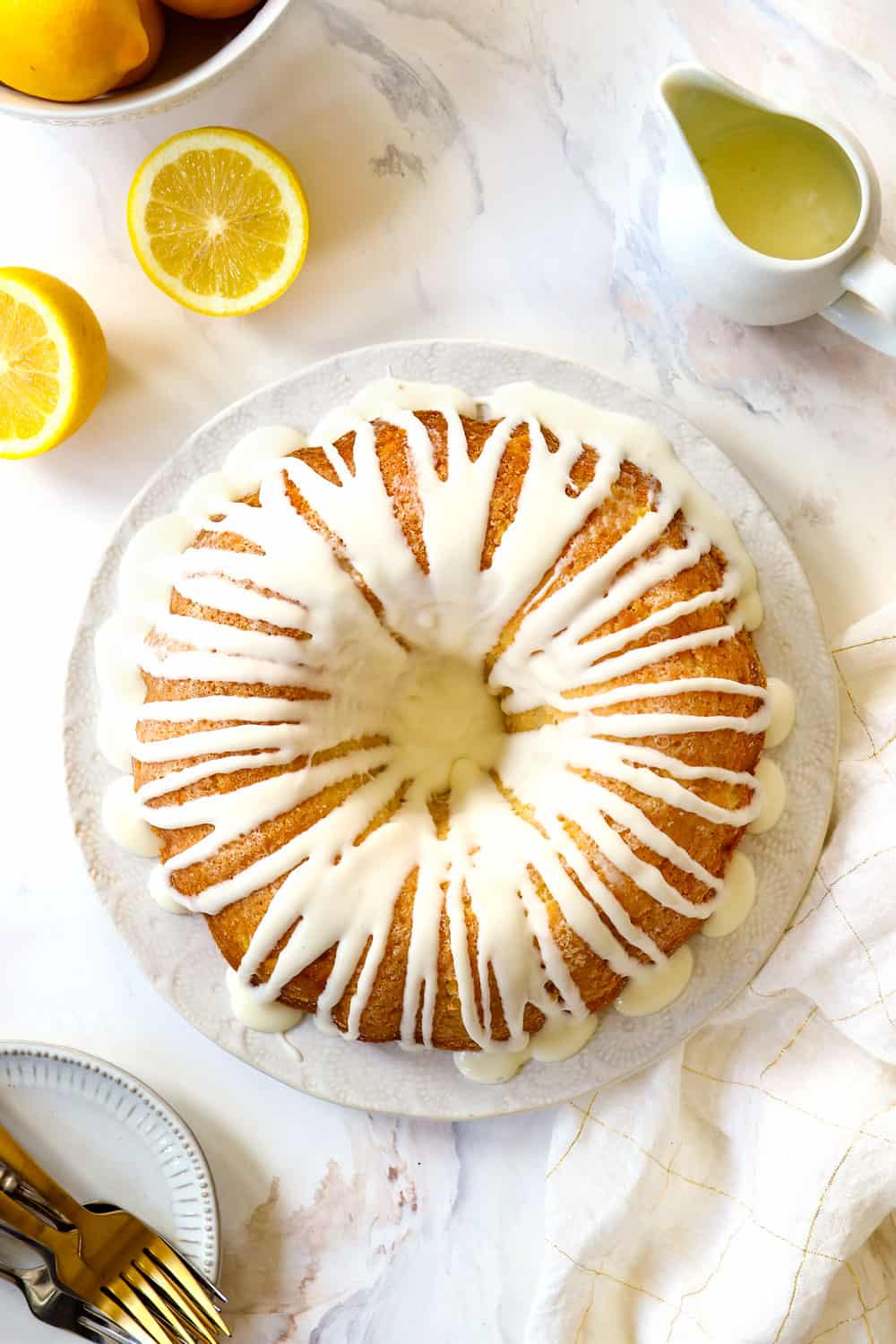 top view of lemon pound cake recipe on a white plate with lemon glaze for cake