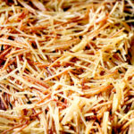 showing how to make fideo by browning fideo pasta in a sillet