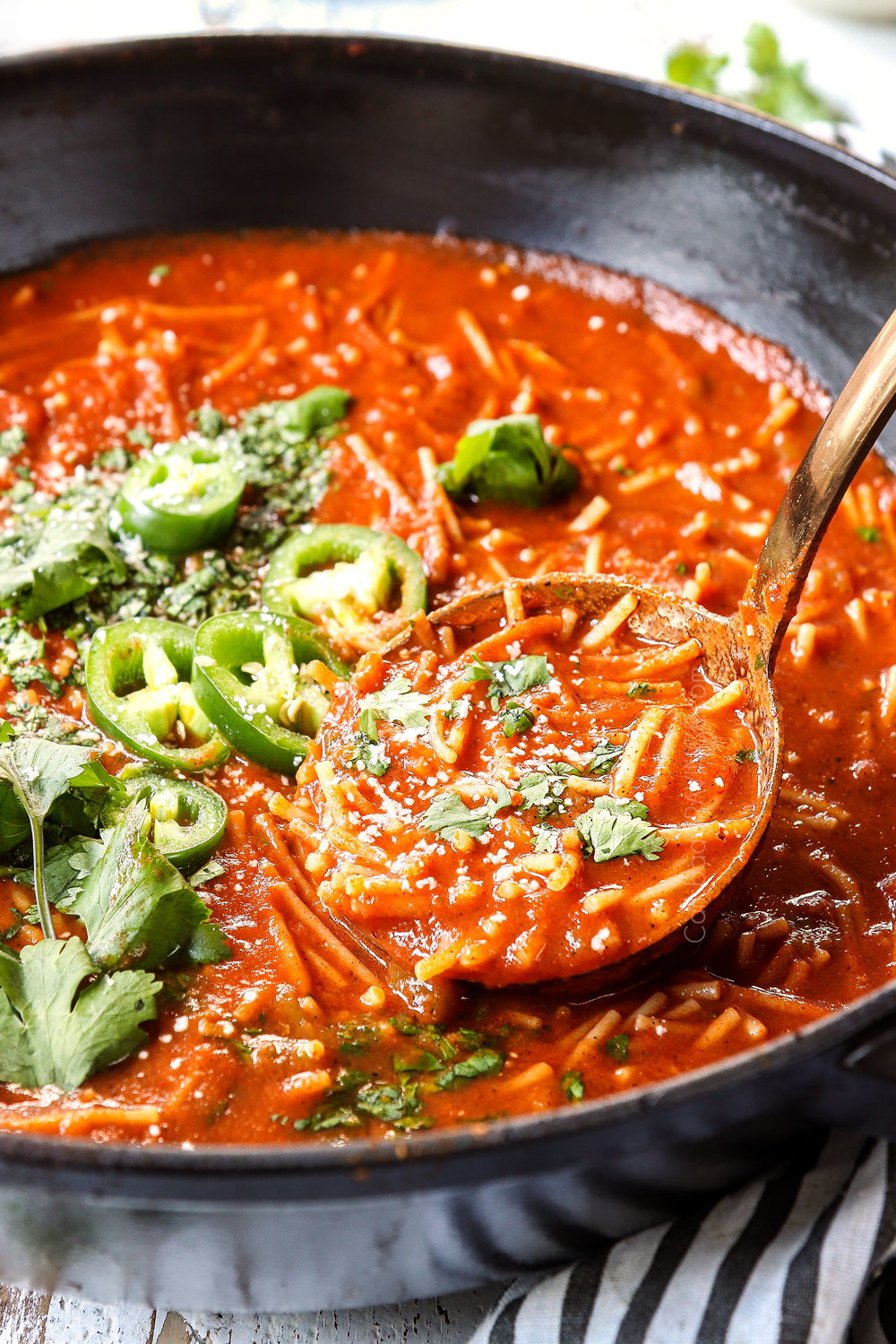 a ladle scooping in fideo recipe