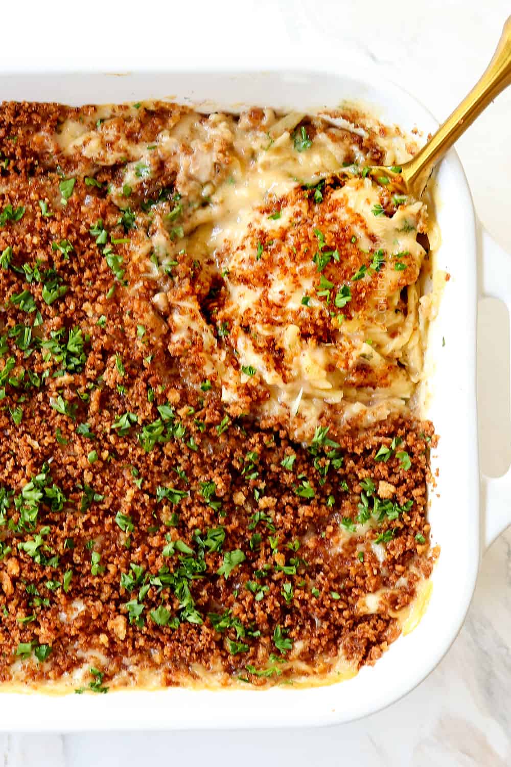 showing how to make chicken cordon bleu casserole by baking until cheese is melted