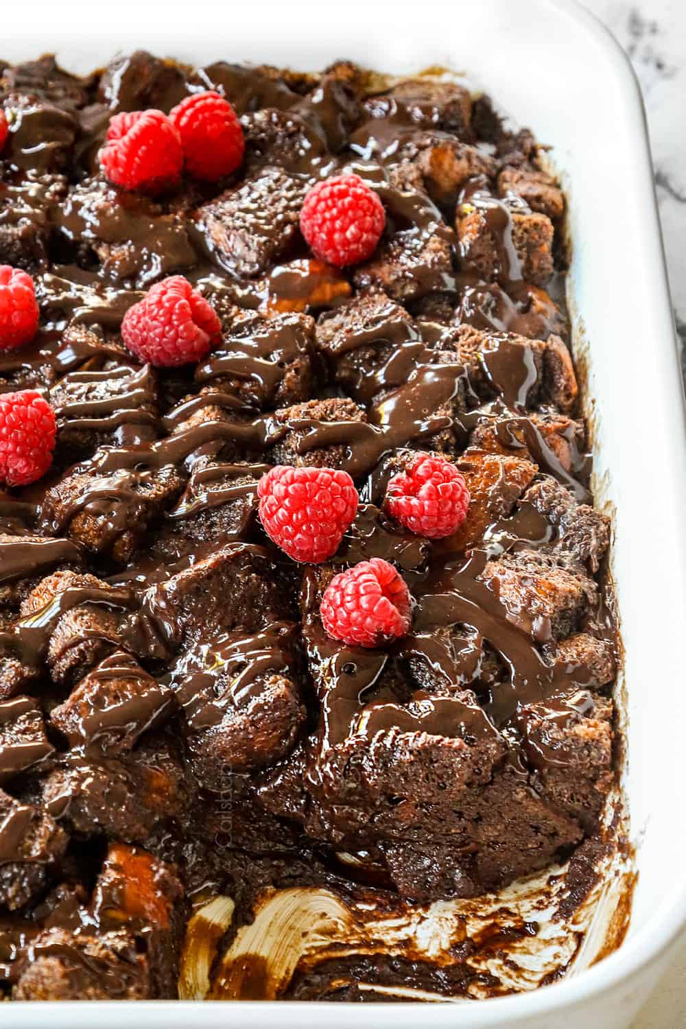 up close of bread pudding in a 9x13 baking dish showing how creamy it is