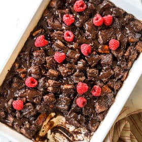 top view of bread pudding recipe in a 9x13 baking pan with a slice missing