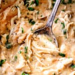 up close a spoon scooping up chicken and gravy recipe in the crockpot