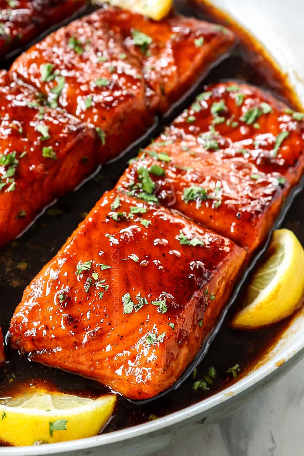 up close of honey garlic glazed salmon showing how juicy it is