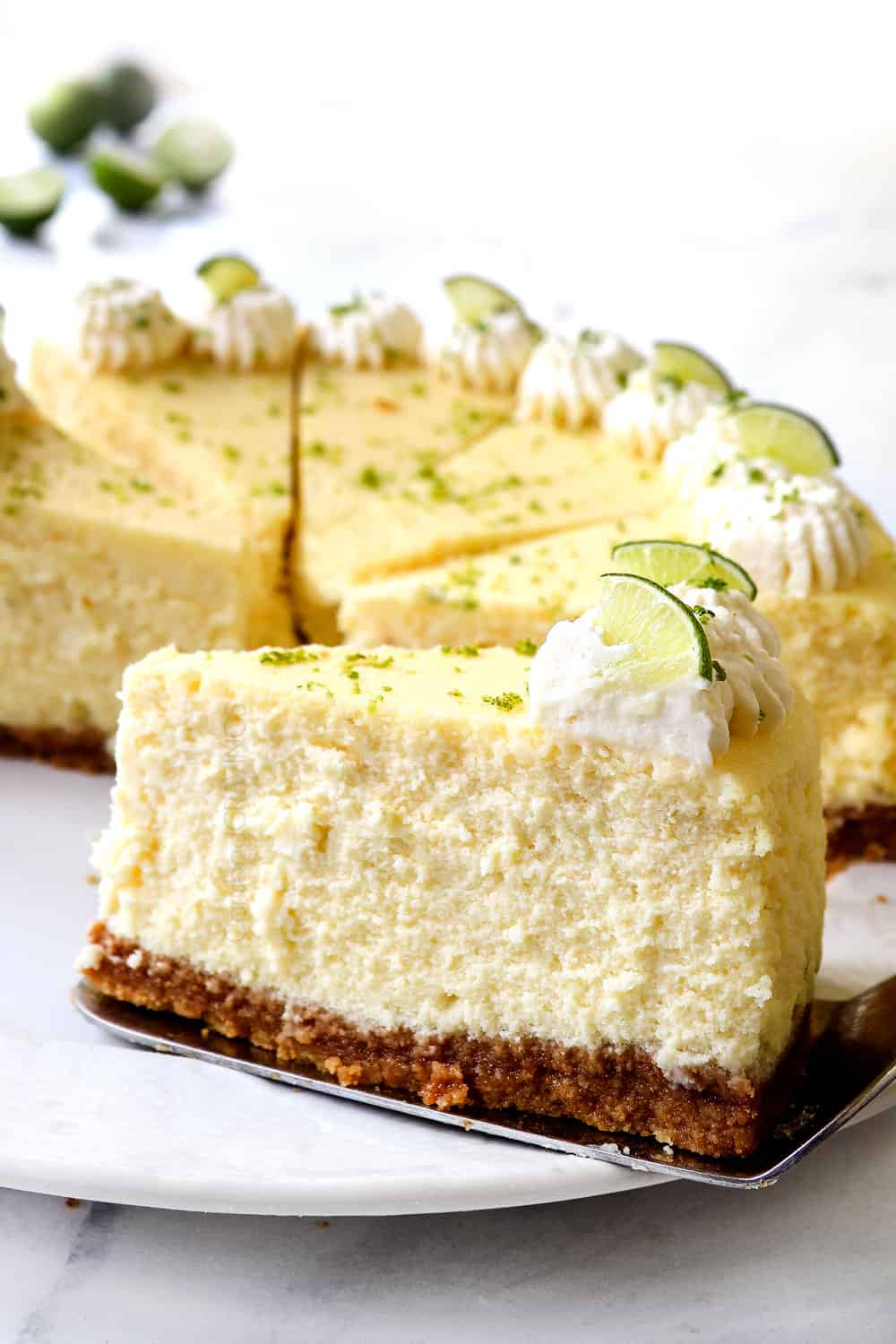 up close of a slice of key lime cheesecake showing how creamy it is