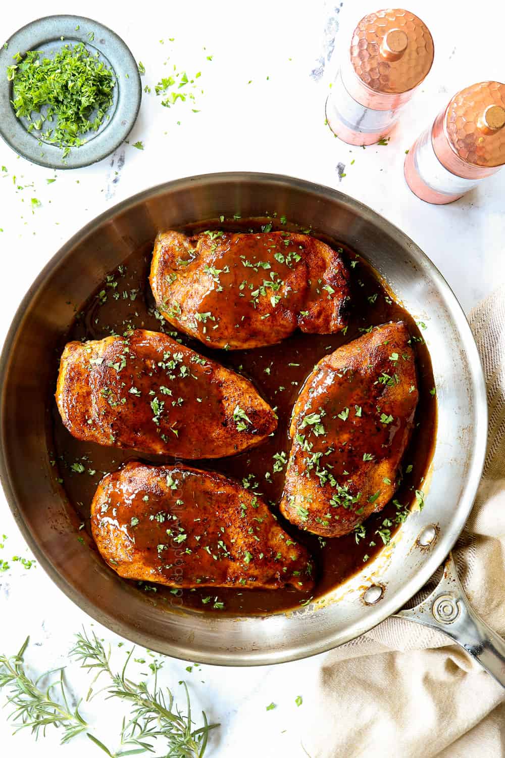 up close top view of brown sugar chicken recipe garnished with parsley