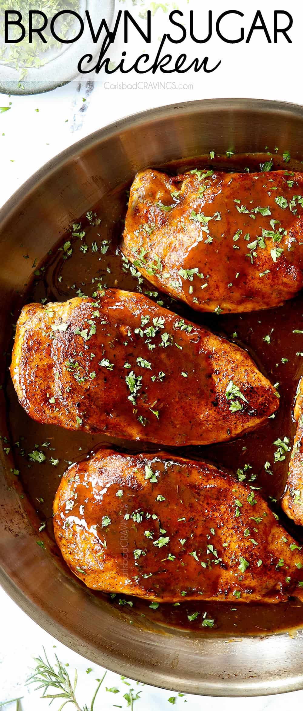 up close top view of garlic brown sugar chicken in a stainless steel skillet