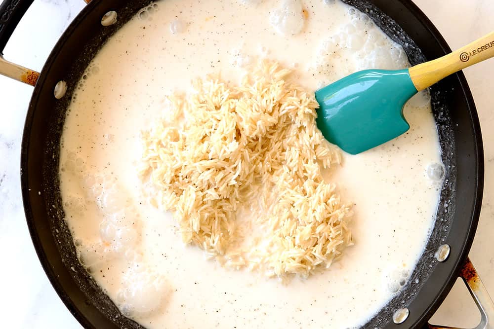 showing how to make coconut rice by adding coconut milk and water to sauacepan