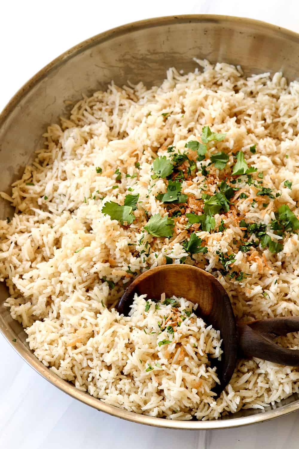 top view of coconut rice in a stainless steel skillet