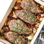 top view of Greek chicken garnished with feta and parsley