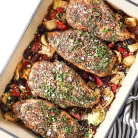 top view of Greek chicken garnished with feta and parsley