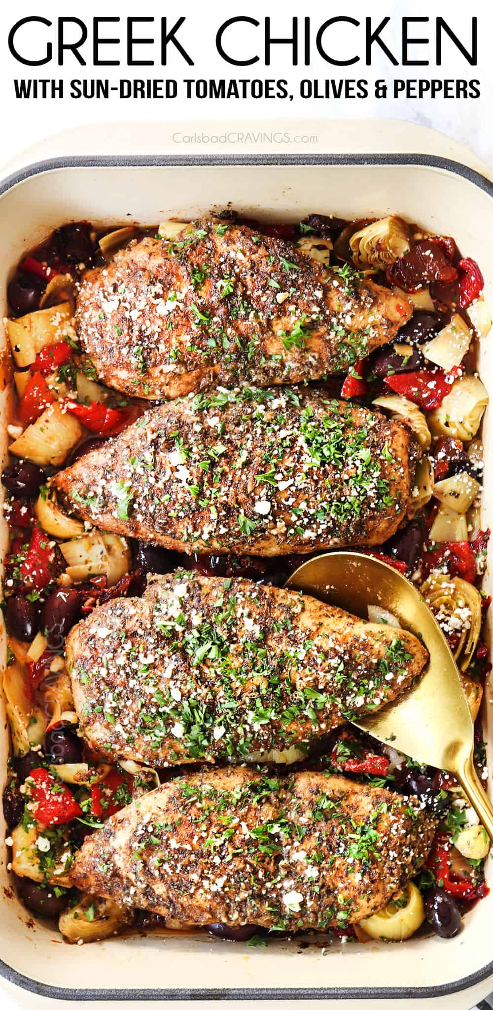top view of Greek chicken in a 9x13 inch baking dish