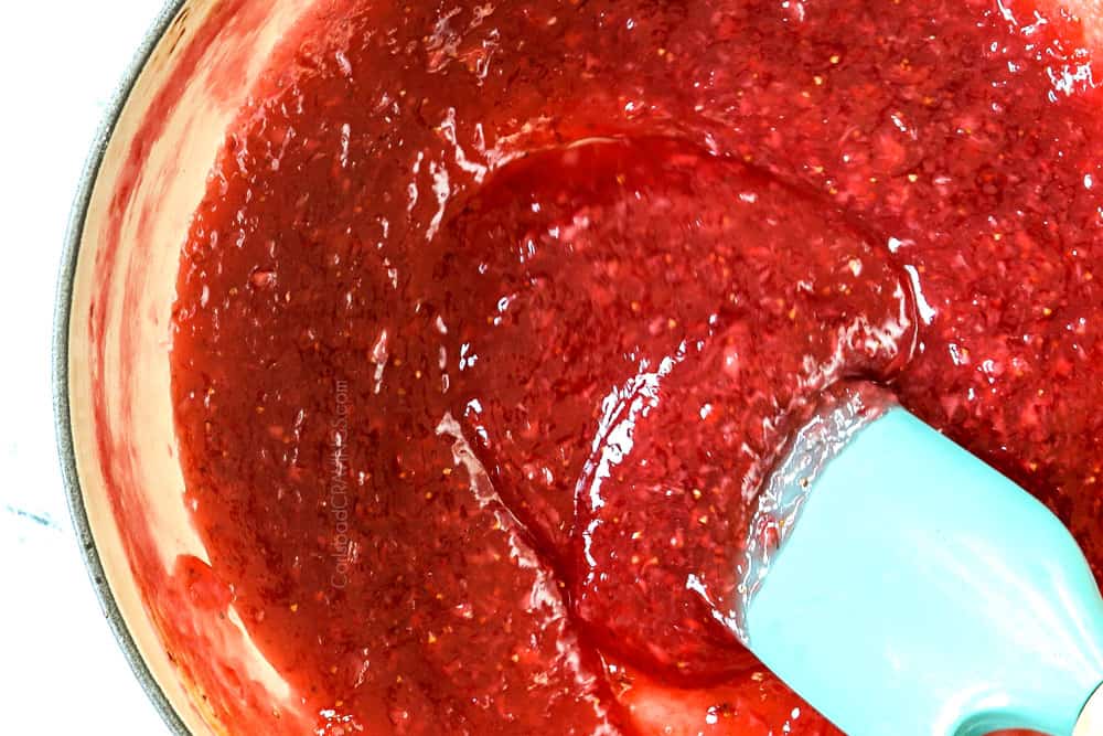 showing how to make strawberry pie recipe by simmering strawberry pie filling until thickened