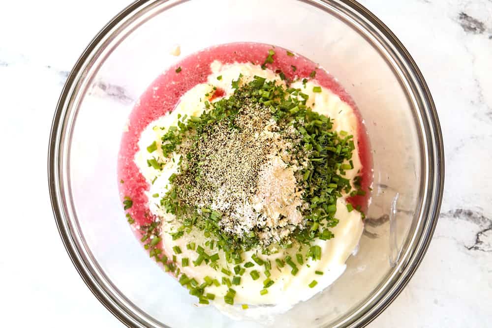 top view showing how to make broccoli salad dressing by adding mayonnaise, yogurt, vinegar, sugar and spices to a glass bowl,