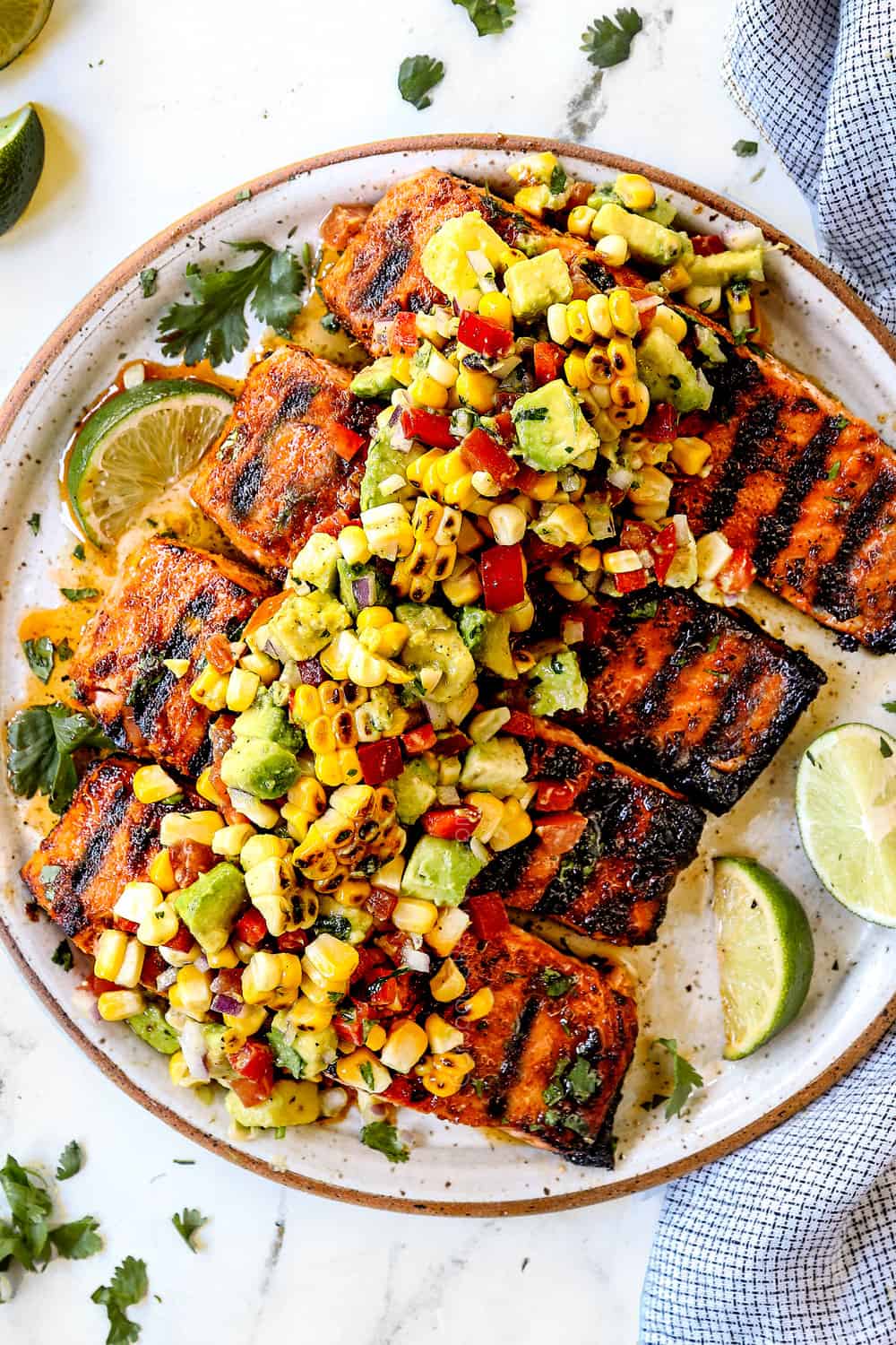 top view of avocado corn salsa on salmon