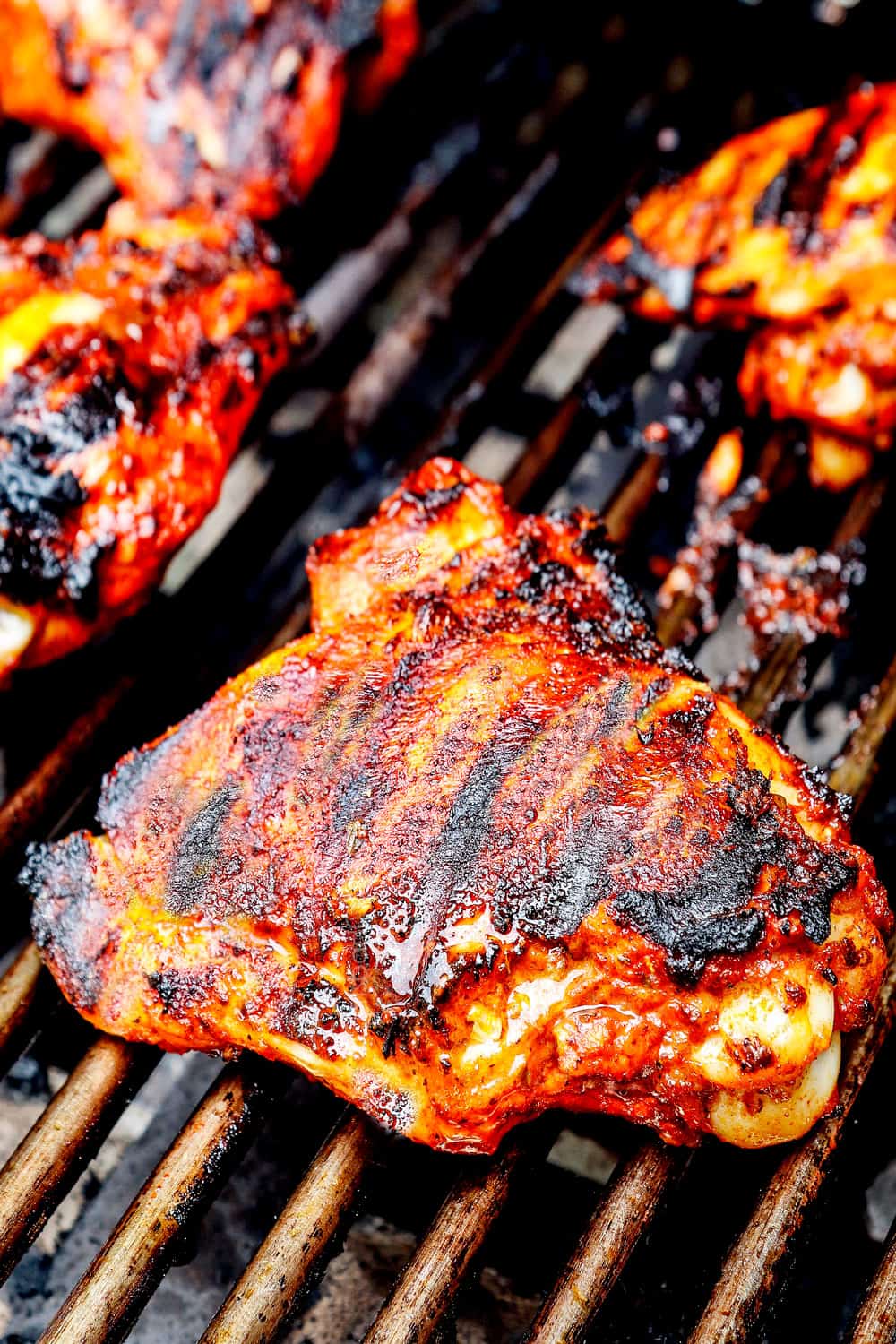 showing how to make pollo asado recipe by grilling chicken