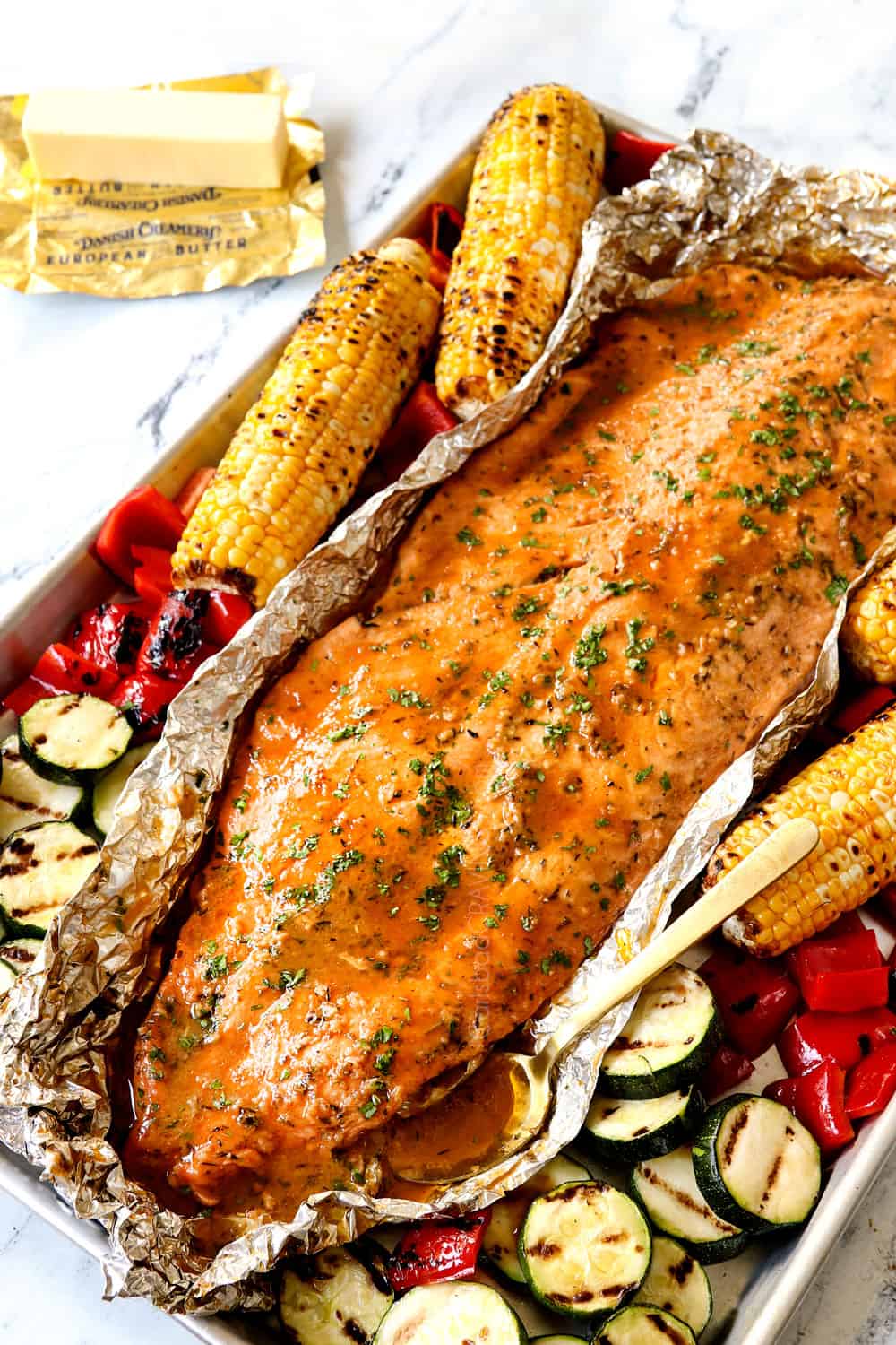 grilled salmon in tin foil with grilled zucchini and grilled bell peppers