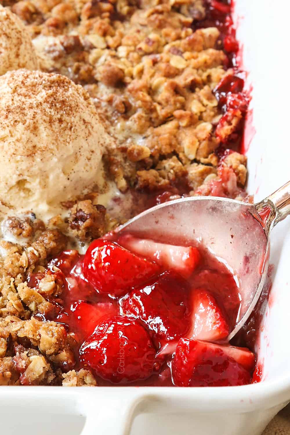 up close of a spoon of strawberry crisp recipe filling