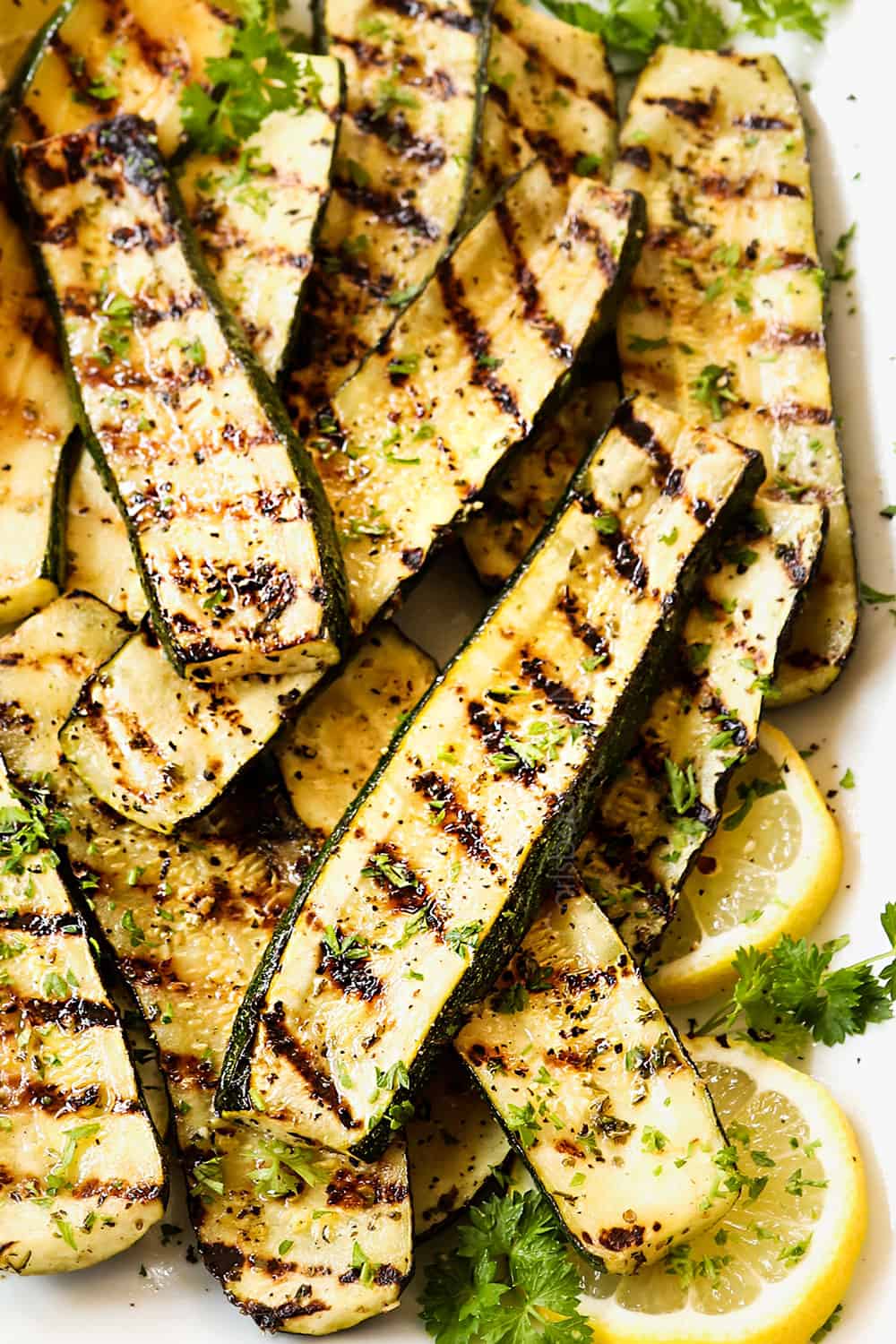 up close of grilled zucchini recipe showing distinct grill marks and how thick the zucchini is