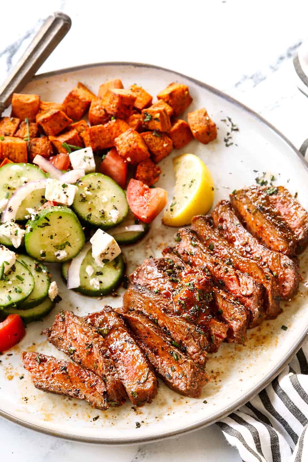 showing how to serve showing how to make New York Strip Steak (Strip Steak, NY Strip Steak) by thinly slicing steak across the grain