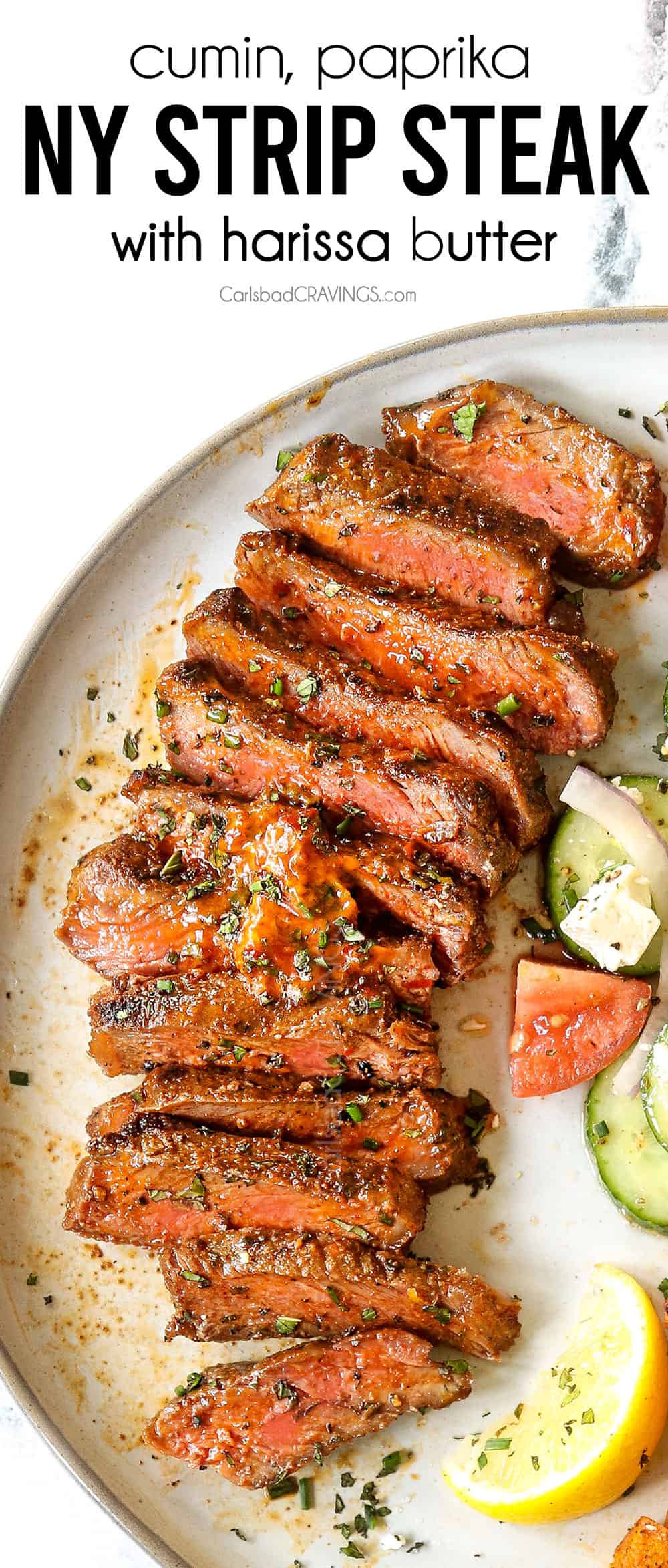 up close top view of New York Strip Steak (Strip Steak, NY Strip Steak) sliced on a plate with compound butter