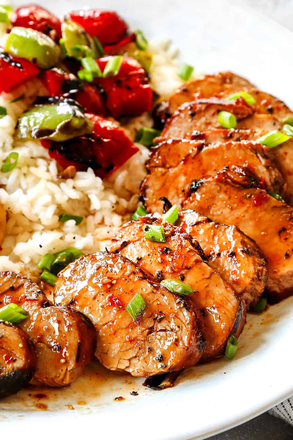 up close of pork tenderloin marinated showing how juicy it is