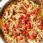 top view of bacon pasta with garlic and Parmesan in a skillet
