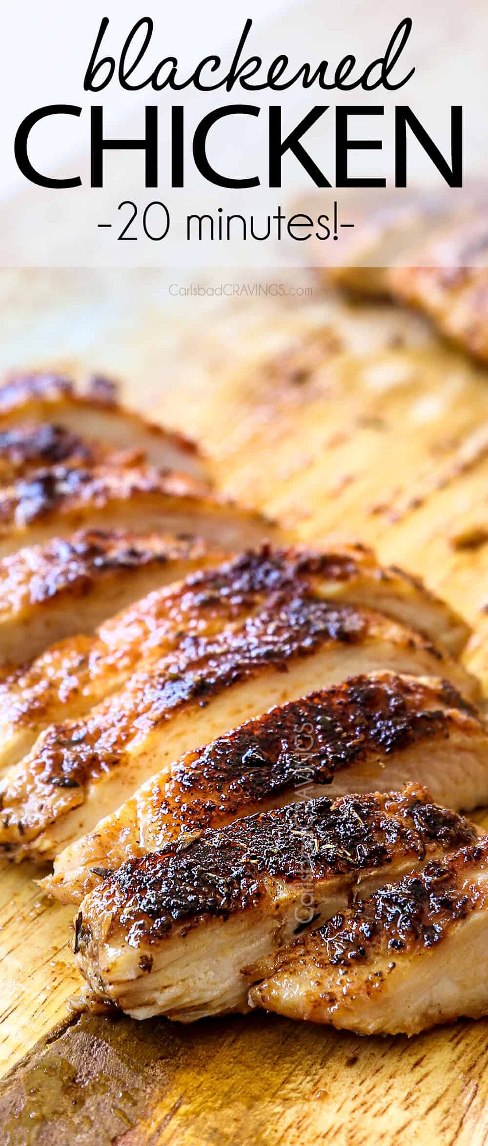up close of blackened chicken on a cutting board showing how juicy it is