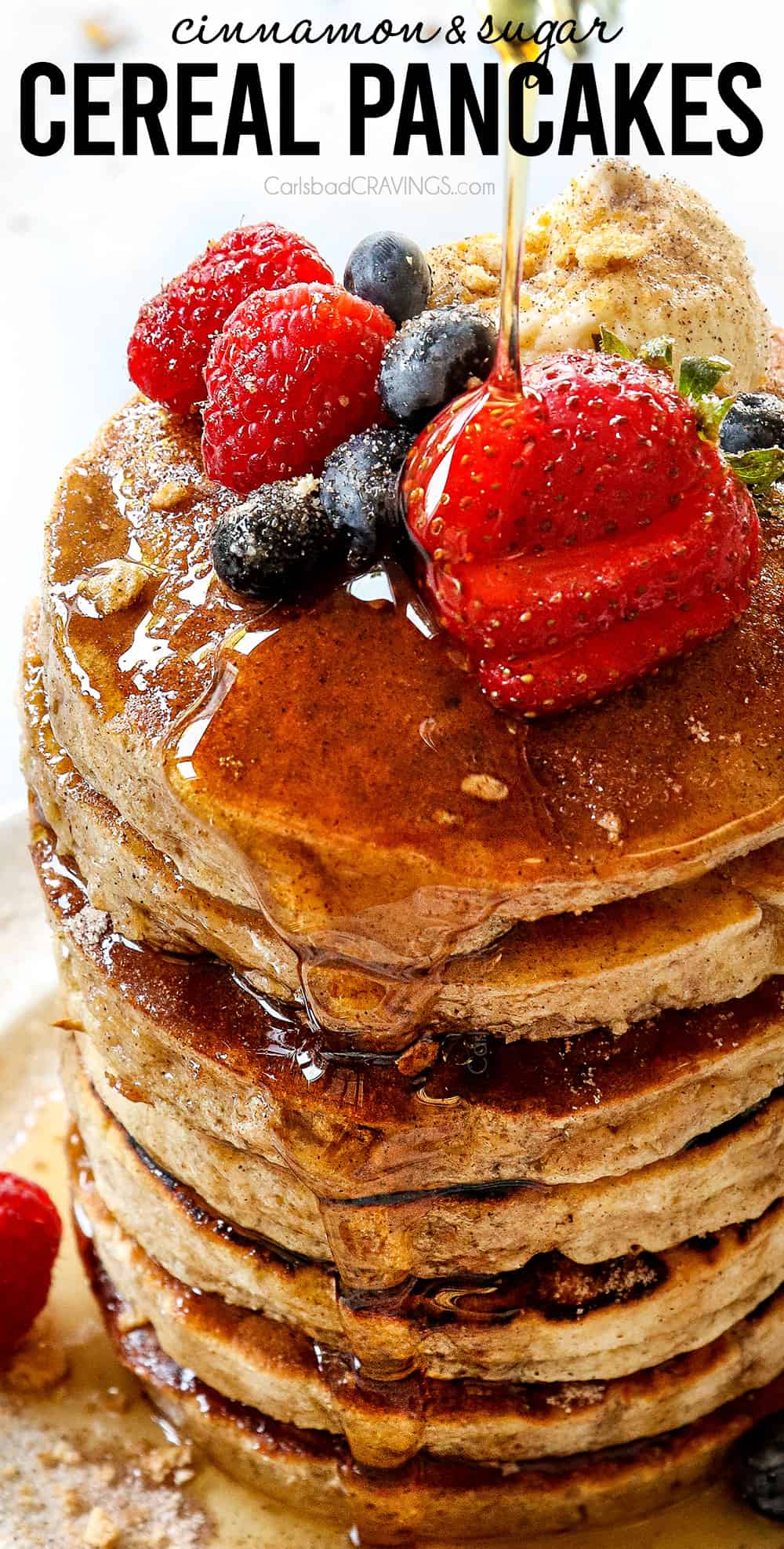 up close of pouring syrup over cereal pancakes