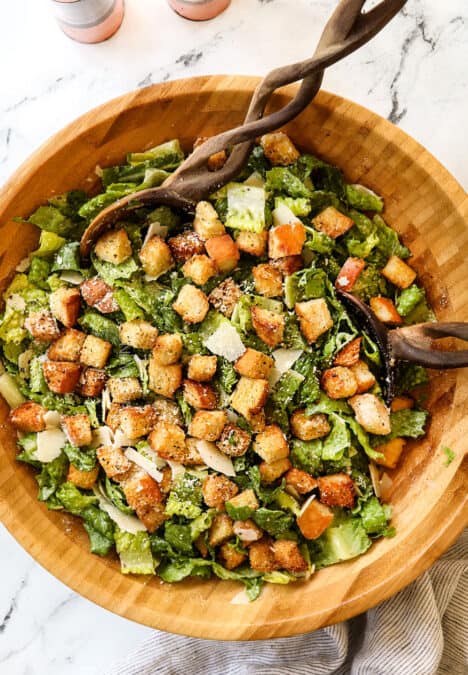 top view of Caesar Dressing recipe with Romaine lettuce, Parmesan, croutons and Caesar Dressing