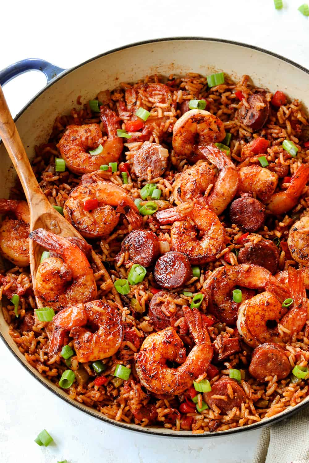 a skillet of Cajun shrimp with rice, sausage, onions, bell peppers and celery