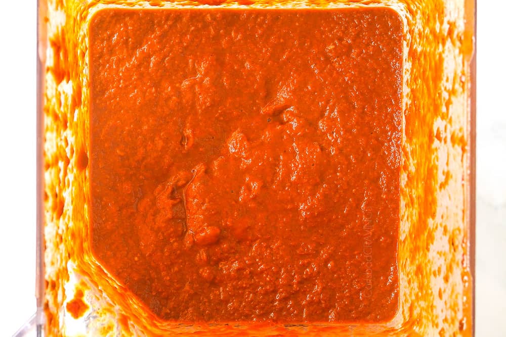 showing how to make birria for tacos by blending the chilies and broth in a high powered blender to make the consommé