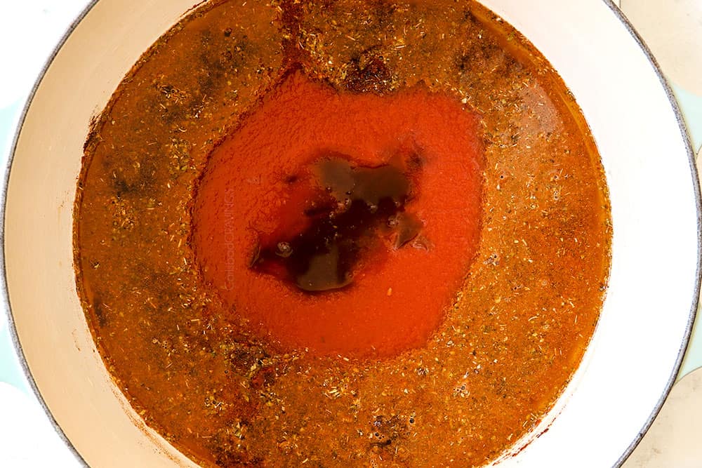 showing how to make Cincinnati Chili recipe by adding beef broth, tomato paste, Worcestershire sauce, apple cider vinegar to a pot