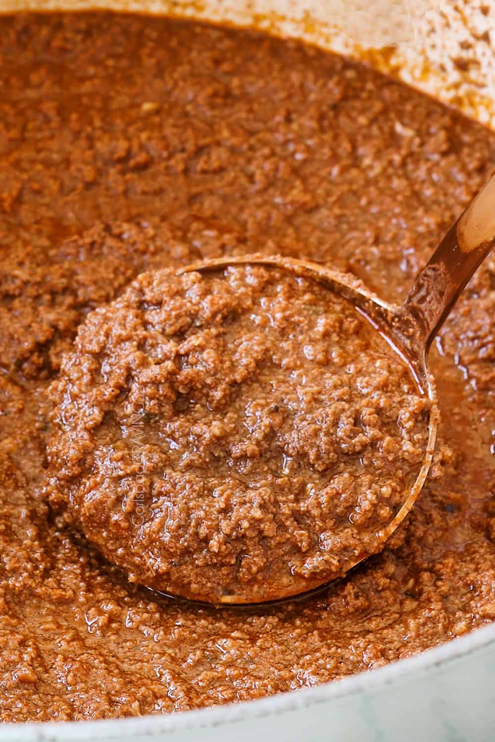 showing how to make Cincinnati Chili recipe by simmering until thickened