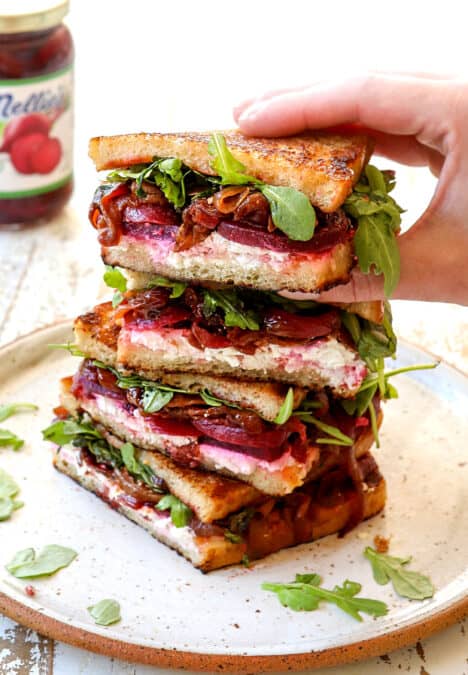 picking up a gourmet grilled cheese sandwich