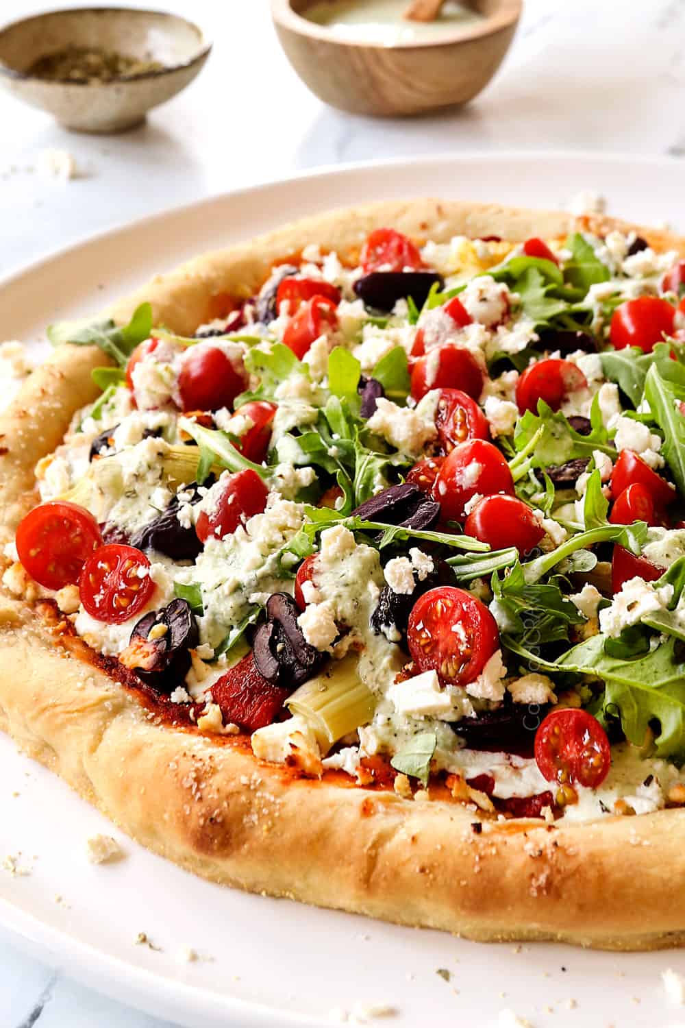 up close of Greek pizza showing how soft and chewy the crust is