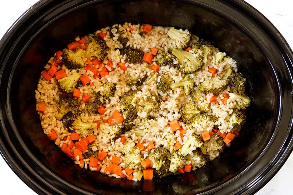 showing how to make Chicken and Rice Crockpot recipe by cooking until the rice is tender